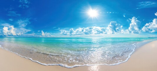 The serene beach with vibrant blue ocean and fluffy clouds in the sky.