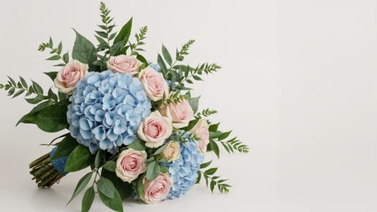 Summer wedding flowers: hydrangea and pink rose bouquet in nature