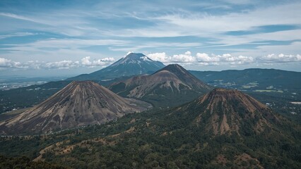 Fototapeta premium Mountains surrounding a volcano during an eruption