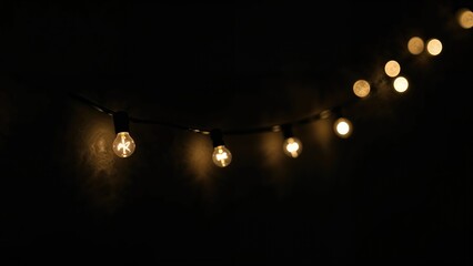 Glowing blurred light bulb garland for festive overlays