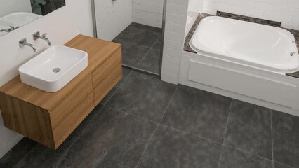 Fototapeta premium Bathroom layout with deep-colored tile flooring and shower tile detailing. Visual of a vanity unit with a white sink bowl and a white whirlpool tub