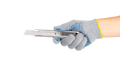 A gloved hand holds a sliver-shaped, light gray tool isolated on solid white background in Png