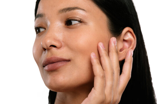 Young Woman Touching Her Smooth and Radiant Skin