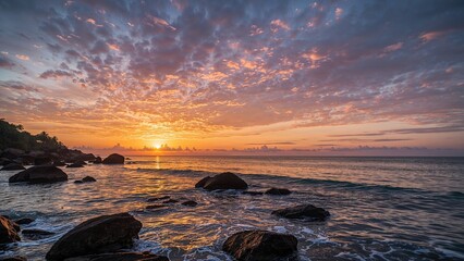 Gorgeous multicolored dusk over the water and large stones