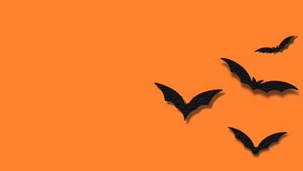 Minimal Halloween Background with Flying Paper Bats on Orange