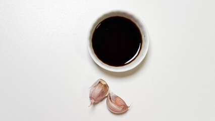 Dark soy elixir whispers with garlic duets, invoking Lunar New Year culinary traditions and the quiet magic of Umami Day
