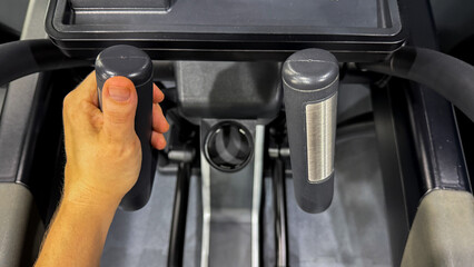 A determined hand guides sleek elliptical handles, echoing the Lunar New Years promise of transformative renewal and grit