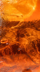 Molten amber ice in fiery sunset glow, conjuring volcanic cocktails or summer solstice festivals,...