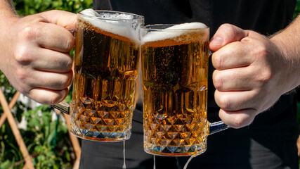Cheers with frothy amber beer mugs, embodying Oktoberfest zeal and International Beer Day...