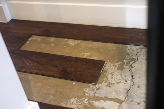 Slab Leak Water Damage Under Laminate Flooring
