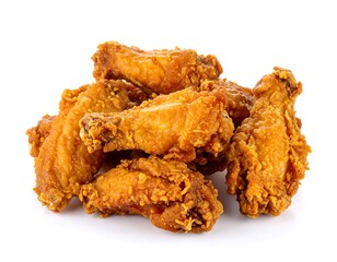 Mouthwatering pile of crispy fried chicken wings isolated on clean white background