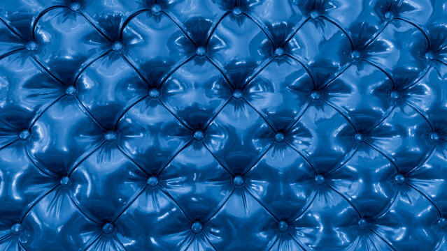 Retro furniture upholstery material in blue. Blue faux leather fabric with a pattern of blue squares. Upholstery material of headboard in form of three-dimensional diamonds.