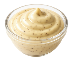 Glass bowl filled with creamy Dijon mustard speckled with visible black pepper, showcasing a smooth and swirled texture, ideal for culinary and cooking concepts.