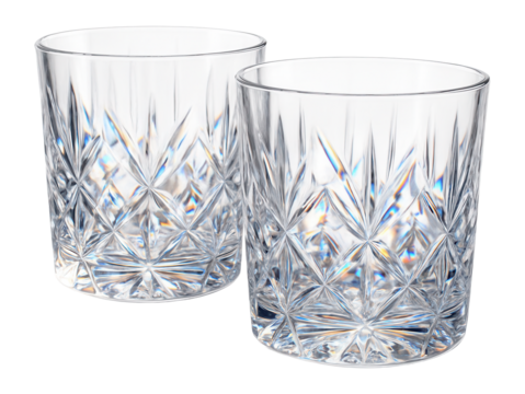 Two elegantly designed crystal tumblers with intricate geometric patterns reflecting light, ideal for showcasing luxury glassware or dining settings.