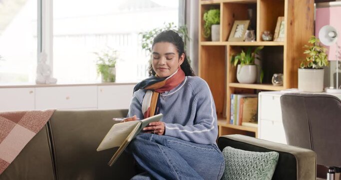 Woman, diary and happy with writing on sofa, relax or reflection with notes, journal or idea at home. Girl, writer and book on couch with smile, thinking or creative process for poetry in living room