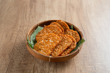 Tempeh, Tempe Goreng or Fried tempeh is Indonesia traditional food, made from fermented soybean seeds. Perfect for recipes, articles or any cooking content.