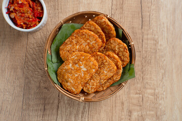 Tempeh, Tempe Goreng or Fried tempeh is Indonesia traditional food, made from fermented soybean seeds. Perfect for recipes, articles or any cooking content.