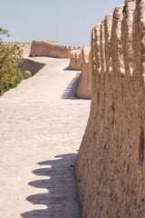 Walking path along the ancient mudbrick walls of the historic city of Khiva, Uzbekistan