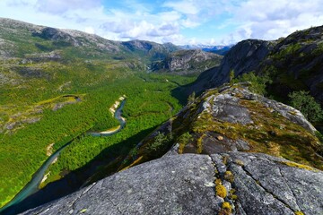 Naklejka premium Rago National Park - impressive view of Storskogelva River that meanders through the wide valley as seen from the vicinity of Litlverivatnet and Litlverivassforsen (Sørfold, Nordland county, Norway)