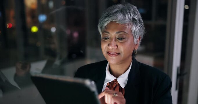 Mature, happy woman and night with tablet for business research, online testament or scroll in office. Female person, lawyer or attorney working late on technology for information or app in workplace