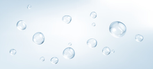 Transparent drops isolated on light blue background. Clear bubbles design elements.