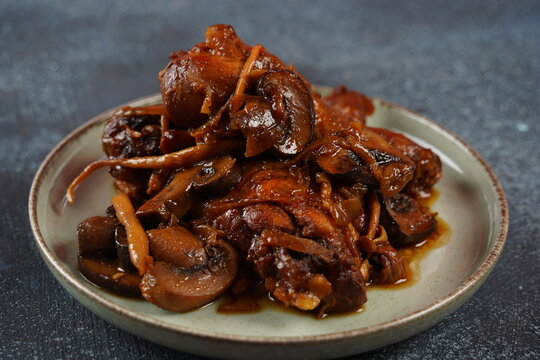 Deep fried chicken with mushrooms ,onions and  date syrup.
