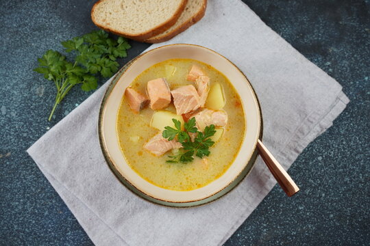 Fish soup in a bowl.Creamy fish soup with salmon, potatoes, onions , carrots, dill and celery. Kalakeitto- traditional dish of the Finnish cuisine or Russian Ukha Fish Head Soup. Healthy Food Concept.