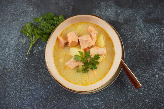 Fish soup in a bowl.Creamy fish soup with salmon, potatoes, onions , carrots, dill and celery. Kalakeitto- traditional dish of the Finnish cuisine or Russian Ukha Fish Head Soup. Healthy Food Concept.