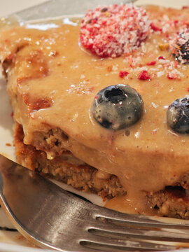 Banana pancakes with nut sauce and berries, close-up