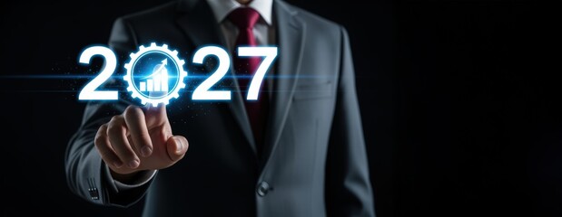 2027 year business growth concept , businessman touch virtual upward graph.


