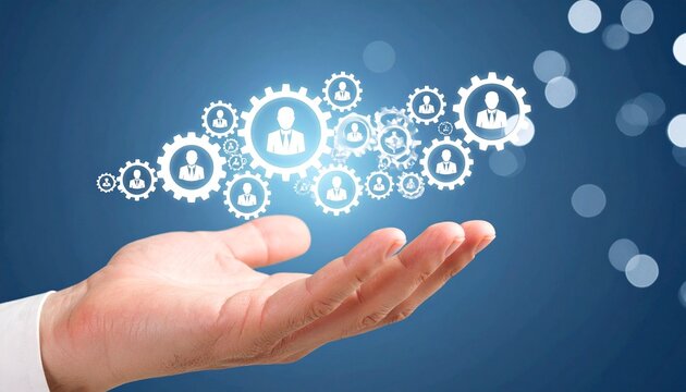 Hand holding interconnected gears with human icons