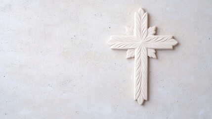 Intricate White Cross Against Textured Beige Background Evoking Spirituality and Tranquility
