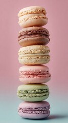 Colorful Stack of Delicious Macarons on a Pink and Blue Background