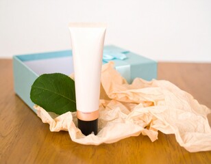 Cosmetic tube in open gift box with tissue paper mockup