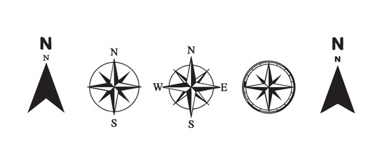 Five black and white minimalist compass rose and north arrow icons direction navigation