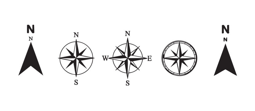 Five black and white minimalist compass rose and north arrow icons direction navigation