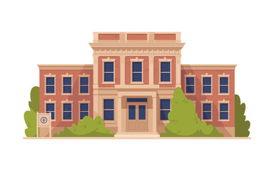 Classic brick building with tall windows and greenery