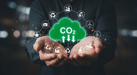 Hands holding a glowing green CO2 cloud with upward and downward arrows, surrounded by environmental icons. Represents carbon neutrality and sustainability initiatives.