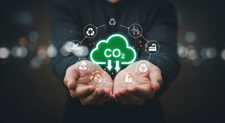 Hands holding a glowing green CO2 cloud icon, surrounded by environmental and sustainability symbols. Represents carbon reduction and eco-friendly solutions.