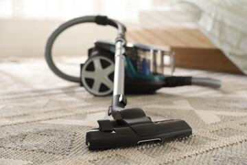 One vacuum cleaner on floor indoors, closeup