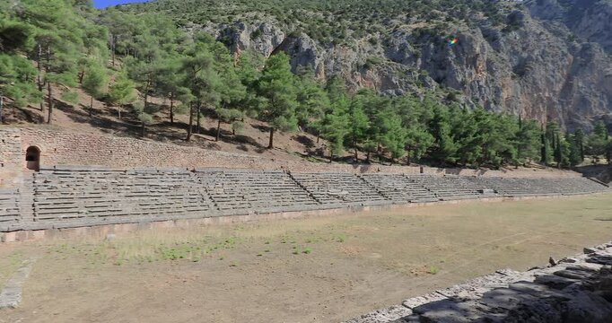 Panning right motion of the The Ancient Stadium of Delphi, it is now an extensive archaeological site, and since 1938 a part of Parnassos National Park, Delphi, Greece, Europe
