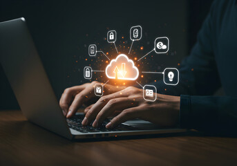 Hands typing on a laptop with a glowing cloud icon and surrounding symbols, representing cloud storage and digital connectivity.