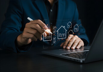 Businessman interacting with holographic house icons and percentage rates using a stylus. Represents real estate management, property investment, and mortgage analysis.