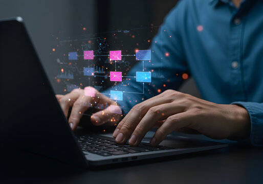 Person typing on a laptop with a glowing network of connected blocks. Represents data flow, business process management, and digital transformation.