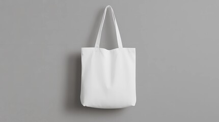 White tote bag mockup on a grey background