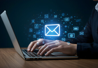 Person typing on a laptop with a glowing email icon and various communication symbols. Represents digital communication, email marketing, and online messaging.