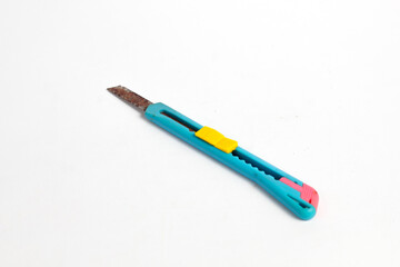 rusty used box cutter showing wear isolated on white background