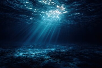 Obraz premium Underwater sunbeams illuminate the deep sea floor
