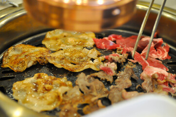 barbecued beef or grilled beef and grilled pork on the broiler or Korean bbq
