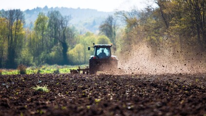 Tractor plowing a field on a bright spring day
